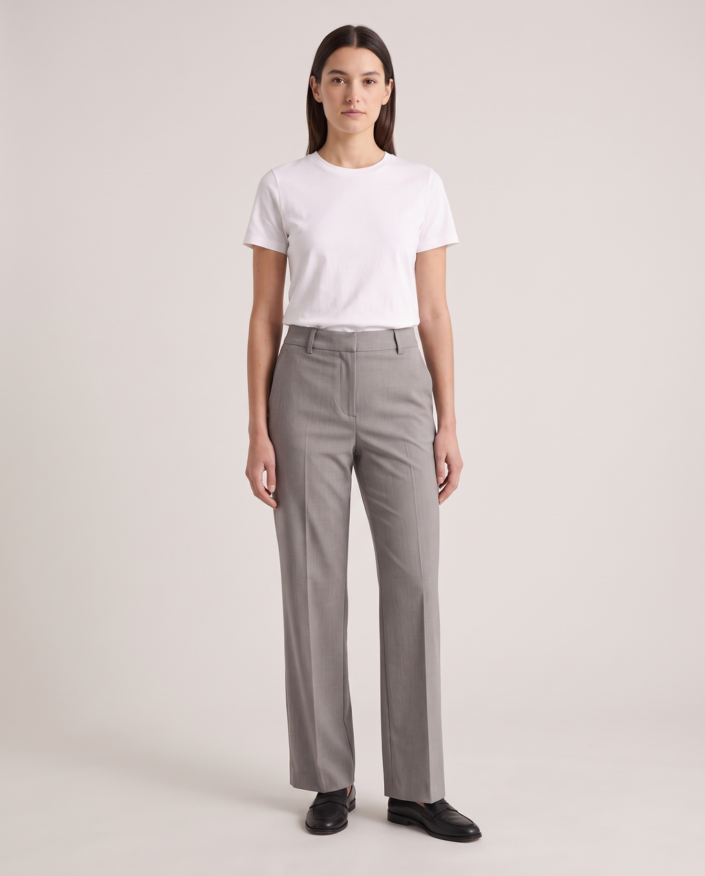 Model wearing the Tailored Trousers in Grey