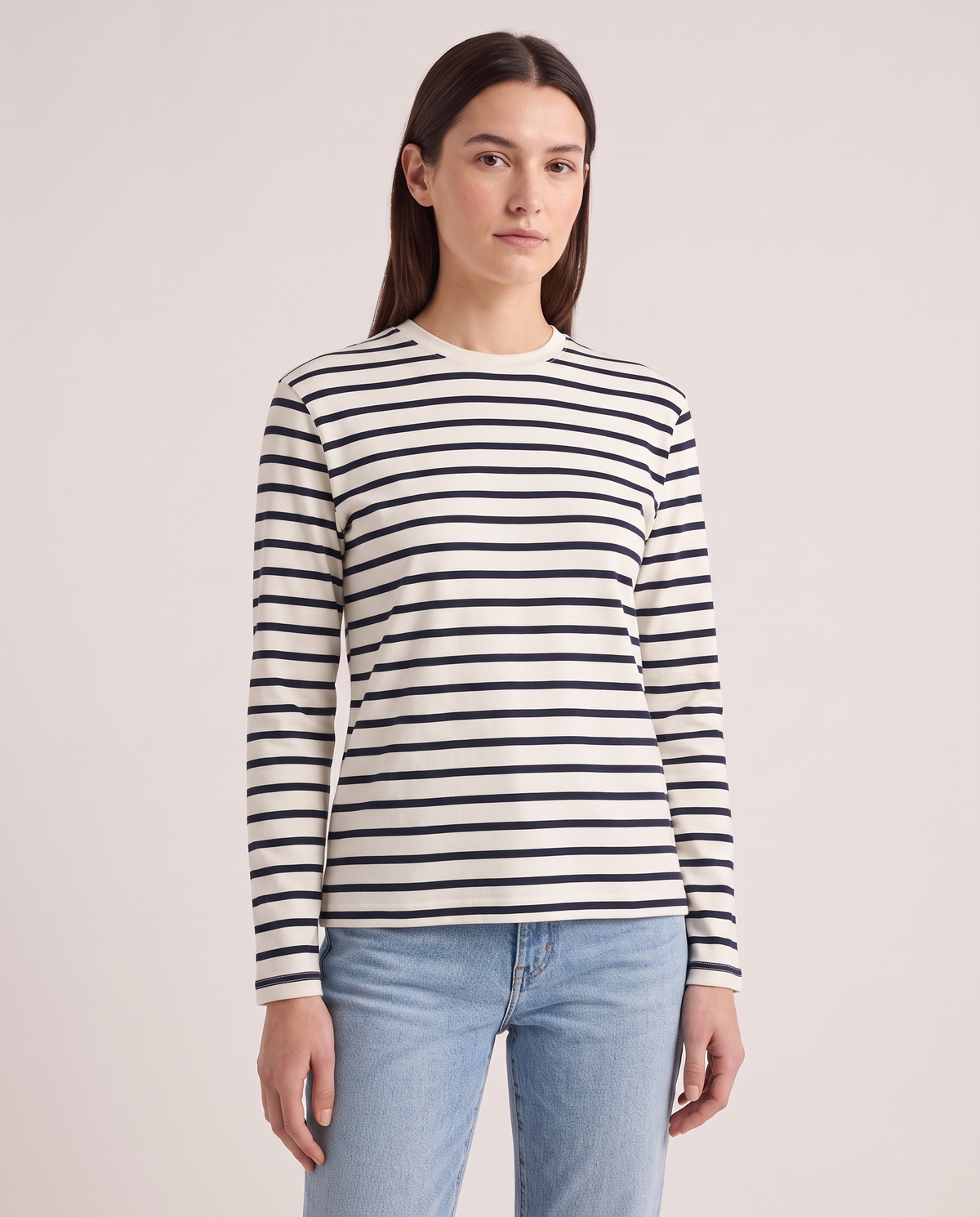 Model wearing the Breton Long Sleeve in Navy/Ecru Stripe